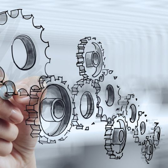 businessman hand draws gear to success concept